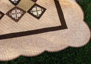 A corner shot of Adam's quilt with Abundant Feathers